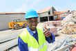 Construction worker on building site with security helmet Construction worker on building site with security helmet