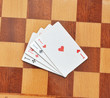 A group of four playing card aces