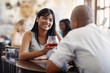 man and woman dating at restaurant