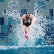 Photo: Swimmer jumping in swimming pool Swimmer jumping in swimming pool