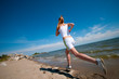 Sport woman running on beach
