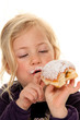 Child in a carnival, with donuts.