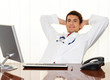 Successful physician sits at a desk