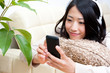 beautiful asian woman listening to music
