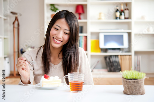 Photo: beautiful asian woman relaxing in the room beautiful asian woman relaxing in the room