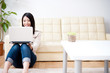 beautiful asian woman using a laptop computer