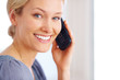 Happy young female talking on cellphone