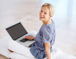 Photo: Cheerful young female working on laptop Cheerful young female working on laptop
