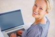 Beautiful young woman working on laptop