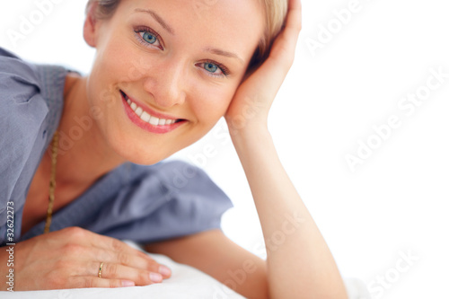 Photo: Happy woman casually leaning on hand Happy woman casually leaning on hand