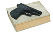 Gun and book