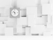 Clock on a wall consisting of white cubes as background