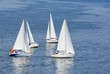 Photo: Four yachts making a close turn near buoy on a summer river. Four yachts making a close turn near buoy on a summer river.