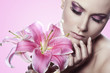 beautiful young sexy woman with flowers on white background