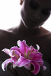 beautiful young sexy woman with flowers on white background