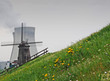 Old windmill with nuclear cooling towers, Antwerp Old windmill with nuclear cooling towers, Antwerp
