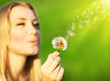 Happy beautiful girl blowing dandelion Happy beautiful girl blowing dandelion