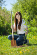 Female gardener planting tree Female gardener planting tree