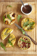 A selection of quiche on a wooden board