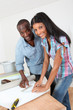 Couple choosing new wallpaper for room