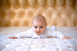 Little baby on a big bed