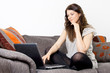 woman using laptop at home