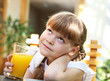 portrait of little girl with orange juice