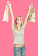 attractive young woman holding shopping bags