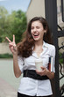 Photo: Happy business woman with coffee and notebook Happy business woman with coffee and notebook
