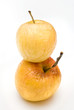 Two yellow autumn  shriveled apples