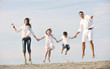 happy young family have fun on beach