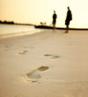 Detail of a human footprints on sand at the beach