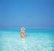 Sexy young woman having bath in sea