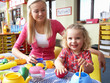 Young woman playing with girl