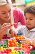 Young woman playing with boy