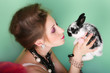 portrait of young beautiful girl with long hair and small rabbit