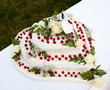 Wedding cake with roses and strawberries.