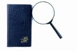 magnifying glass and books