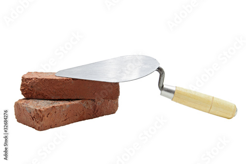 Photo: construction lute trowel with red brick construction lute trowel with red brick