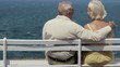 old man and woman on bench at the sea