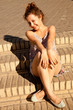 woman sitting on the stairs woman sitting on the stairs