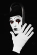 mime holding a walking-stick in his hand