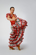 Young woman dancing flamenco with castanets Young woman dancing flamenco with castanets