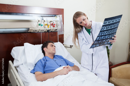 Photo: Doctor showing report to the patient Doctor showing report to the patient
