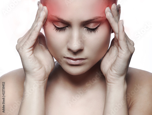 Photo: woman with headache on white background woman with headache on white background