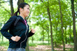 beautiful asian woman jogging in the park