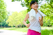 beautiful asian woman jogging in the park