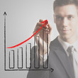 young businessman drawing chart