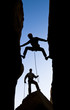 Team of climbers reaching the summit.