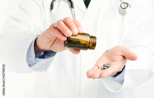Photo: doctor pouring drugs doctor pouring drugs
